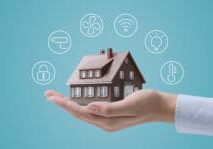Hands holding a smart home model property management challenges