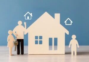 A family holding keys in front of their new home, with the words  Fixed-Rate Loan  glowing above, surrounded by steady financial symbols what size home do I need